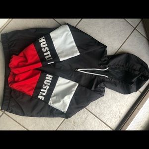 black and red “hustle” windbreaker